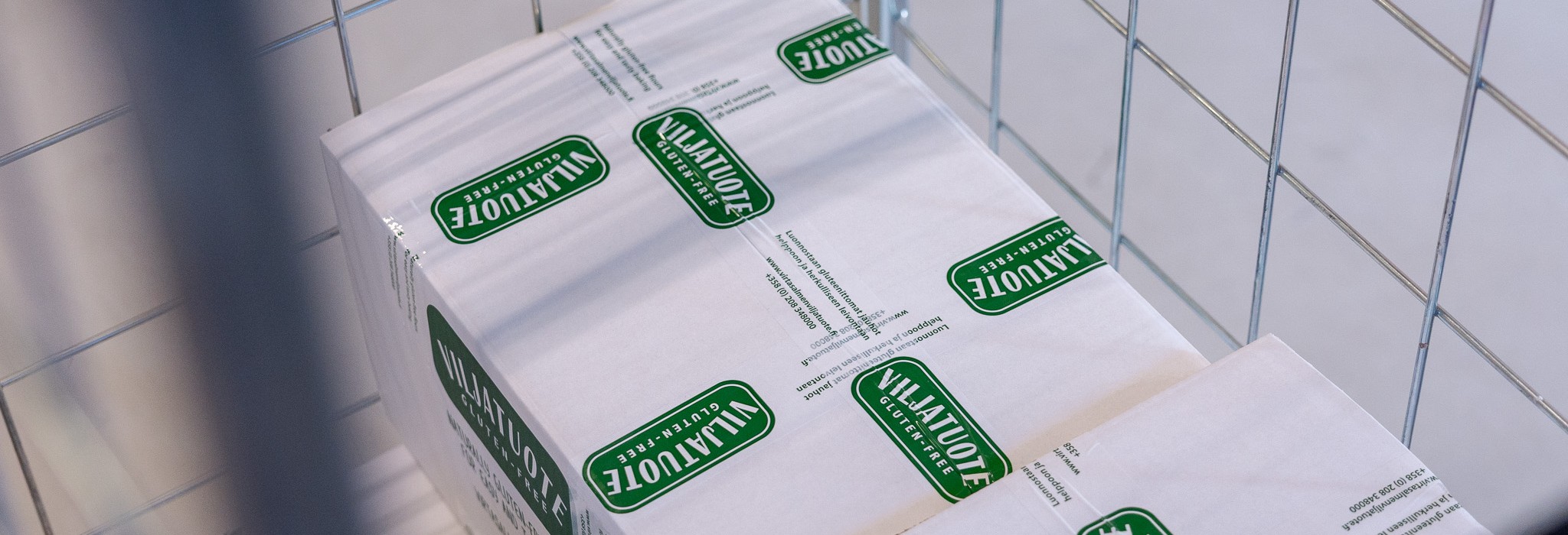 Viljatuote packages in a roll cage